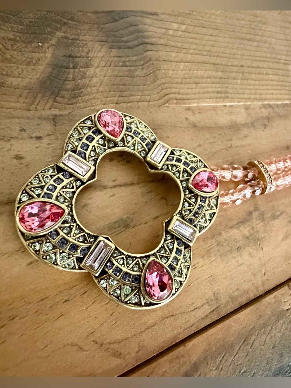 HEIDI DAUS PINK BEADED CRYSTAL NECKLACE FEATURING A QUATREFOIL-SHAPED PENDANT